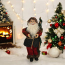 Dekofigur Weihnachtsmann mit Rute und Kostüm in festlichen Farben