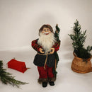 Dekofigur Weihnachtsmann mit Rute und Kostüm in festlichen Farben
